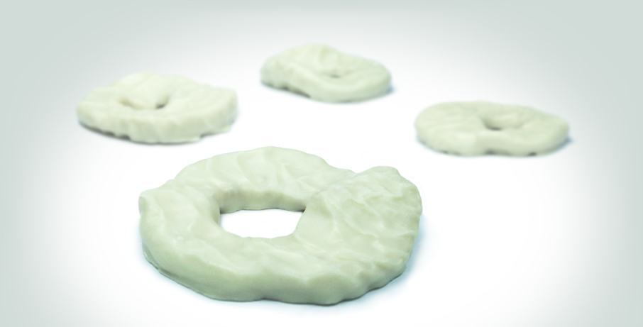 Sour apple rings coated with white chocolate